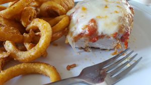 Chicken Parmigiana and curly fries